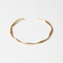 Matte Gold Twist Bangle With Sleek Design