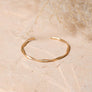 Matte Gold Twist Bangle With Sleek Design