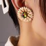 metal flower earrings with gem stone