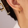 brass hexagon huggie earrings with color cz