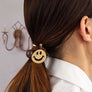 Smiley face hair elastic tie with a grey bead