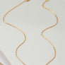 mini smiley face on a delicate chain necklace