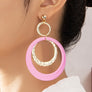 Hammered metal and acrylic hoop drop earrings