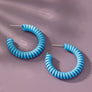 Spiral metal hoop earrings with color coating
