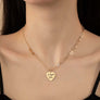 Asymmetric delicate necklace with heart pendant