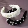 Knotted fabric headband with daisy decor