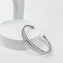 OPEN METAL CUFF BRAIDED BRACELET