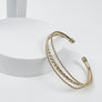 OPEN METAL CUFF BRAIDED BRACELET