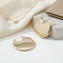 Huggie Gold Puffy Disc Crescent Hoop Earrings