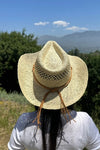 Cowboy  hat in handwoven  straw with a peekaboo pa