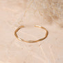 Matte Gold Twist Bangle With Sleek Design