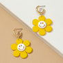 Huggie hoop dangling flower smiley face earrings