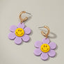 Huggie hoop dangling flower smiley face earrings