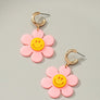 Huggie hoop dangling flower smiley face earrings