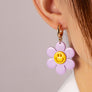Huggie hoop dangling flower smiley face earrings