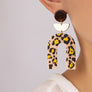 Embossed animal print arch drop earrings