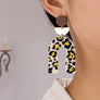 Embossed animal print arch drop earrings