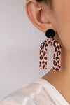 Embossed animal print arch drop earrings