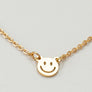mini smiley face on a delicate chain necklace