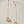 Long chain with dangling ball drop earrings