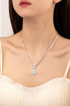 asymmetric chain necklace with coin pendant