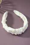 Knotted fabric headband with daisy decor