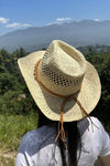 Cowboy  hat in handwoven  straw with a peekaboo pa