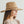 Faux suede wide brim panama hat with braided band