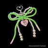 AKA White Pearl and Green Cord Bows Heart Bag Clip