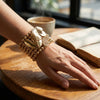 Gold 7 Row Beaded Spring Motif Stretch Bracelet