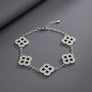 Black Encrusted Quatrefoil Motif Silver Bracelet
